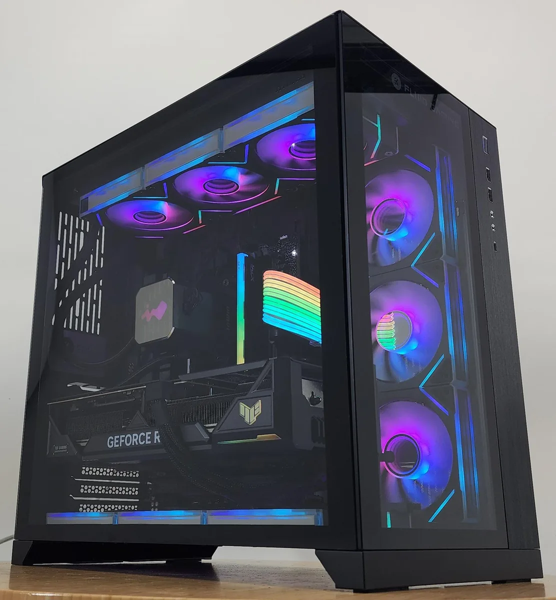 Black Lian Li O11 Dynamic case with 360mm AIO RGB cooler and RTX 4080 graphics card visible through tempered glass side panel