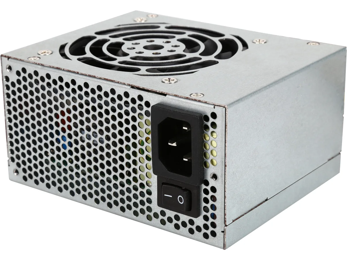 Compact SFX power supply unit in matte black finish with single fan grille and visible cable bundle