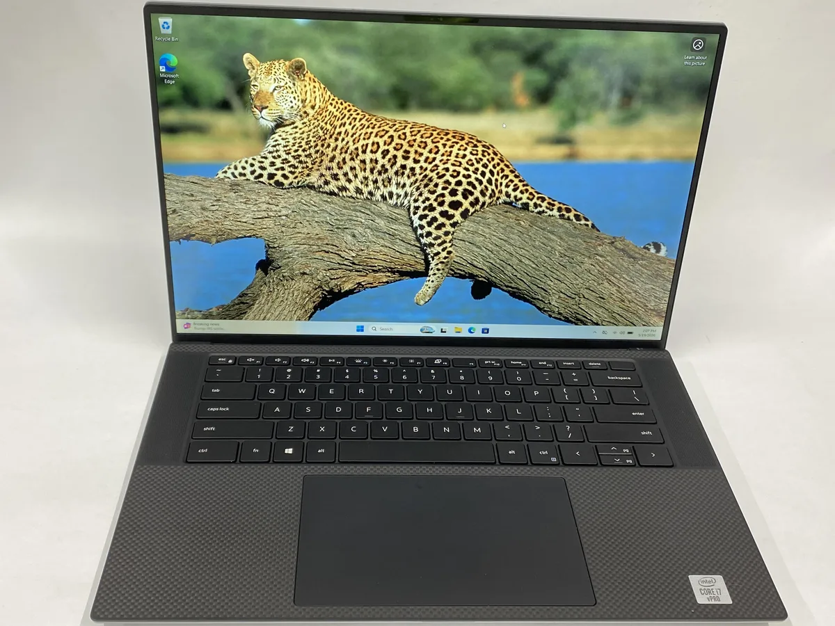 Silver Dell Precision 5550 laptop, 15.6 inch non-touch screen, compact charger included