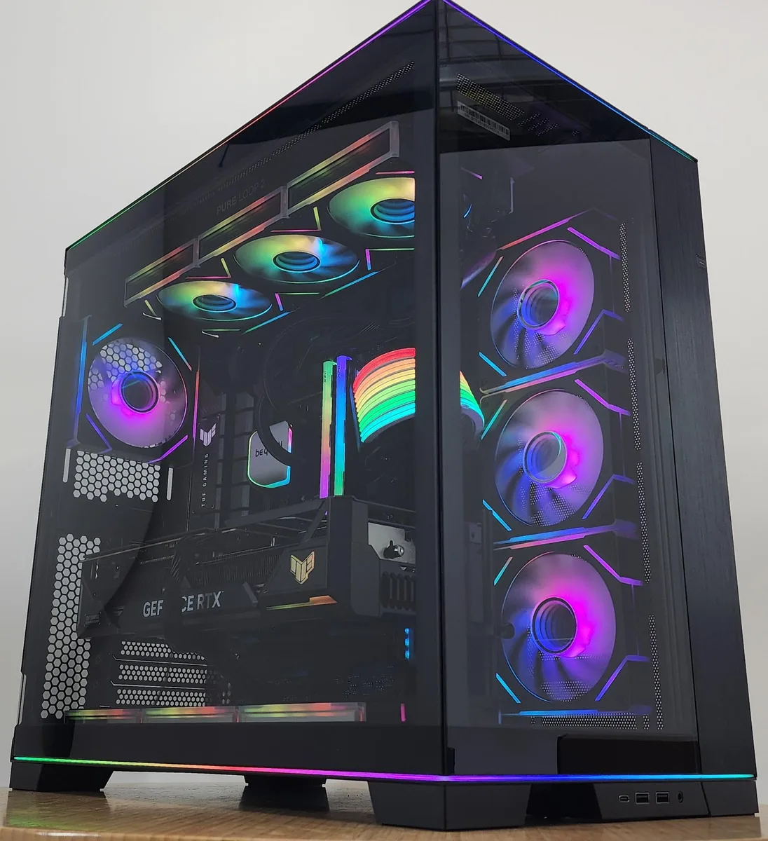 White glass-panel tower with RGB lighting inside