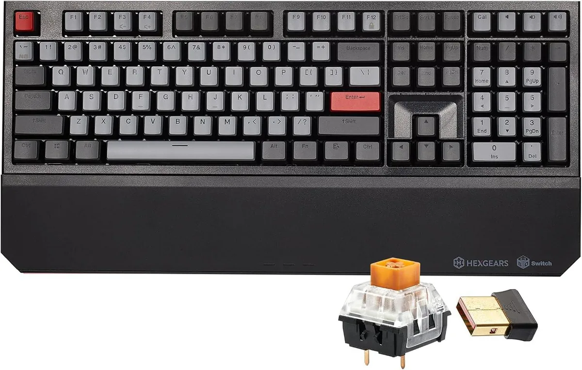 Full-size dark keyboard with 108 keys and wrist rest