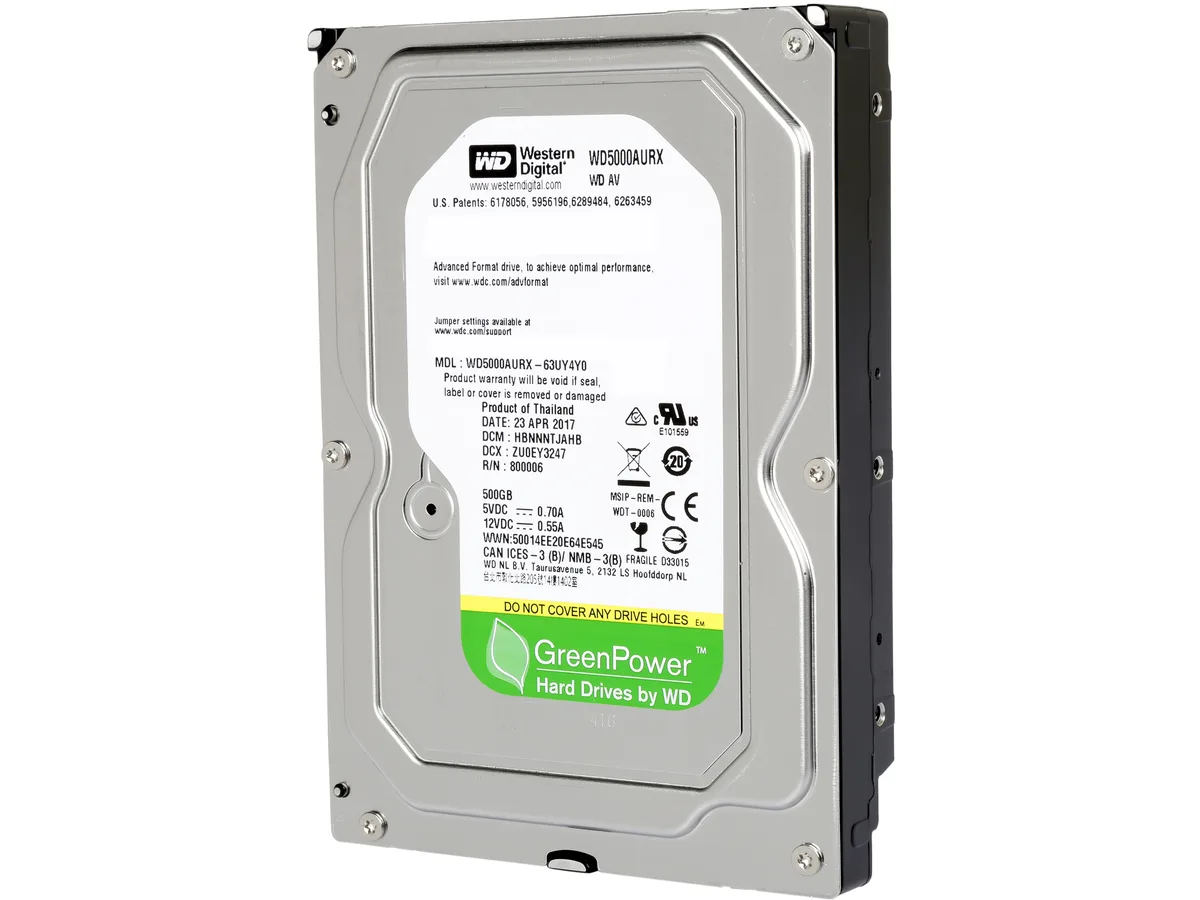 Silver 3.5 inch bare hard drive with green circuit board visible on underside