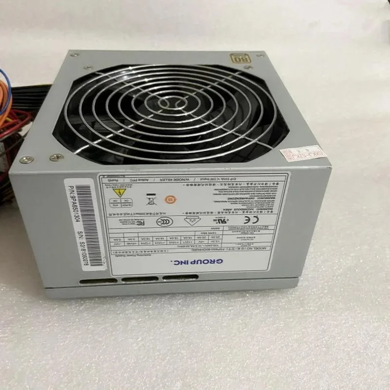 Rectangular black ATX power supply unit with cooling fan grille and power socket visible