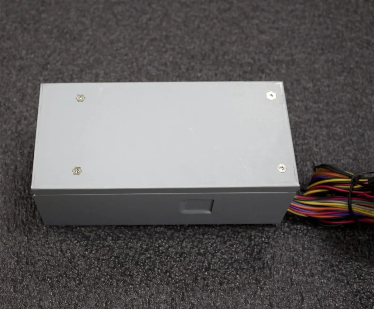 Compact TFX power supply unit with 80mm cooling fan and multiple cable connectors