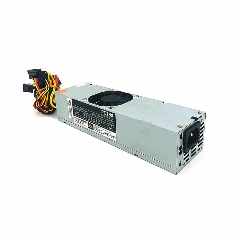 Compact TFX power supply unit in matte black metal casing with rear fan grille and cable bundle