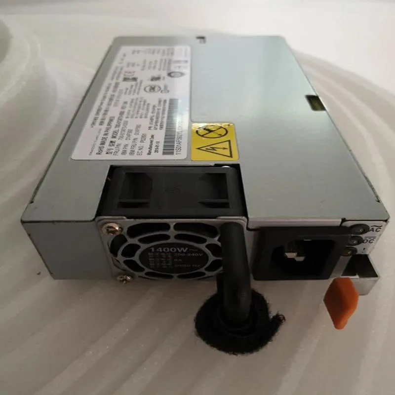 Rectangular black metal ATX power supply unit with ventilation grille and label showing model numbers