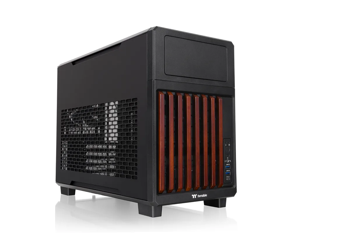 Compact black steel Micro ATX case with stained wood front trim and mesh side panel