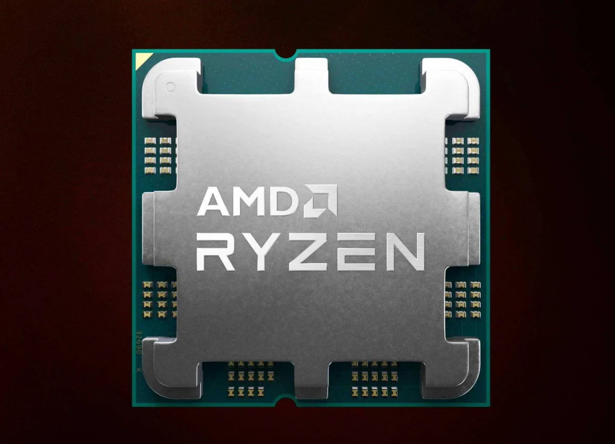 Square green ceramic CPU with gold contacts and silver heatspreader reading Ryzen 9 7950X