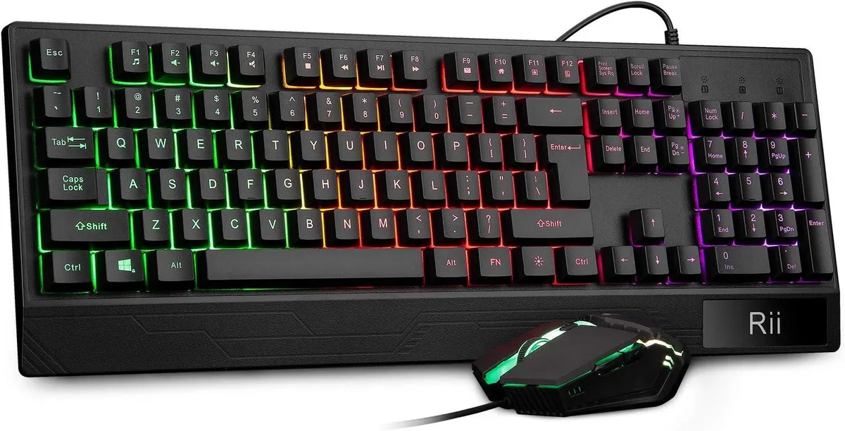 Black full-size wired keyboard with wrist rest and RGB backlighting beside ergonomic gaming mouse