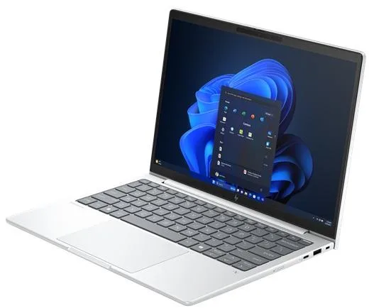 Silver 14 inch laptop closed on plain background