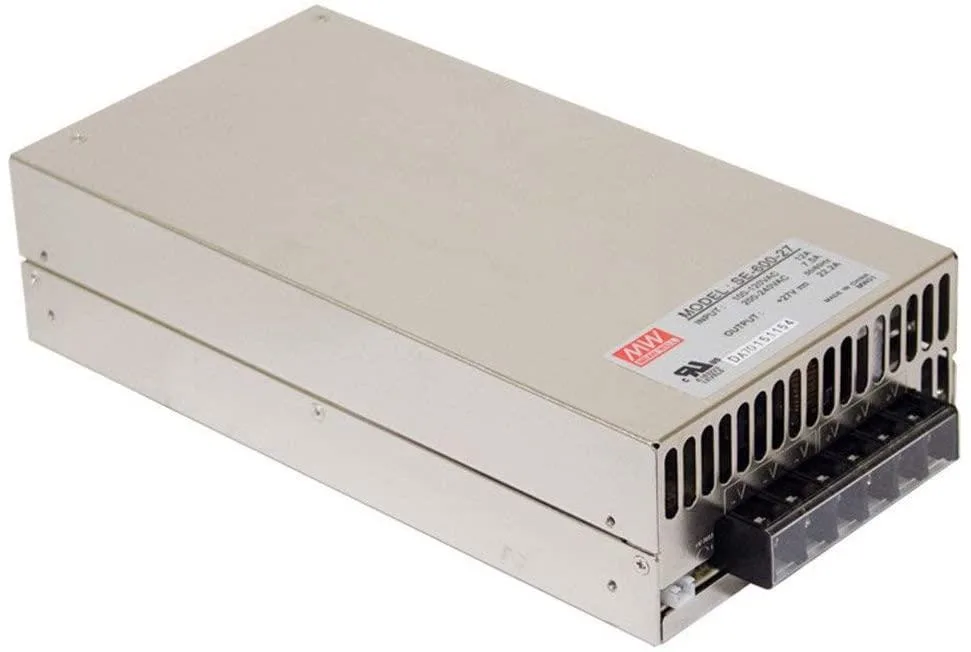 Silver rectangular metal power supply unit with built-in fan and terminal connections