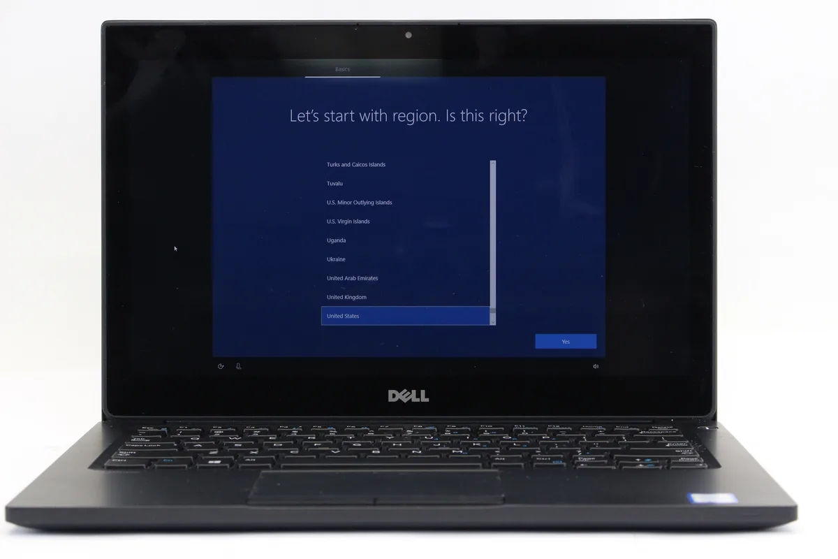 Black 12.5-inch touchscreen laptop with visible side wear, no battery installed
