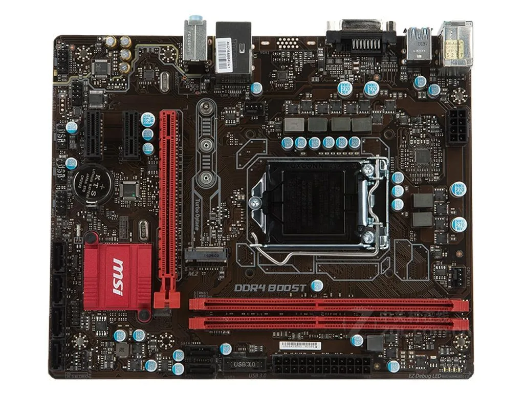 Green Micro ATX motherboard with black heatsinks and silver PCIe slots