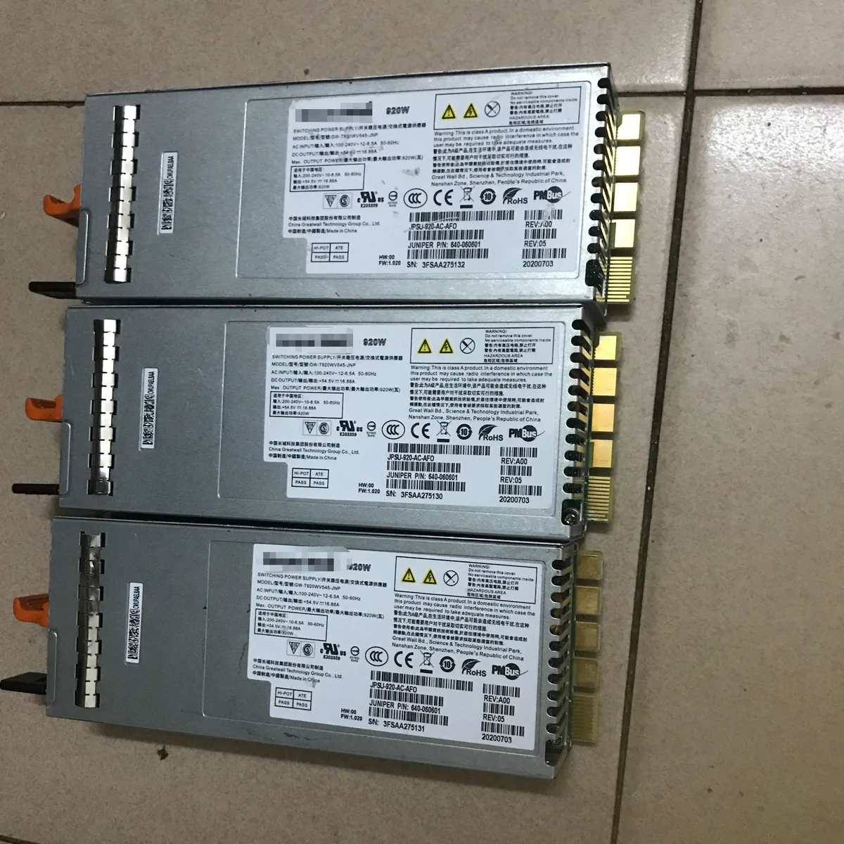 Silver rectangular power supply module with handle and ventilation slots