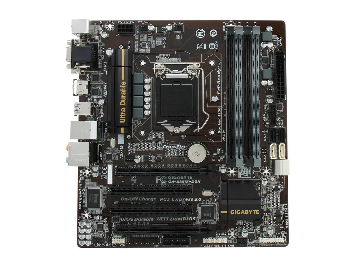 Green micro ATX motherboard with black sockets and silver heatsinks