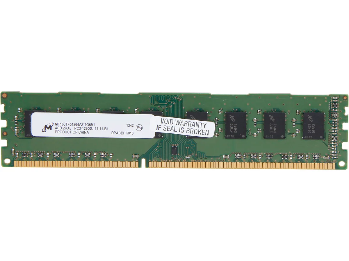 Green rectangular circuit board with black memory chips and gold edge connector