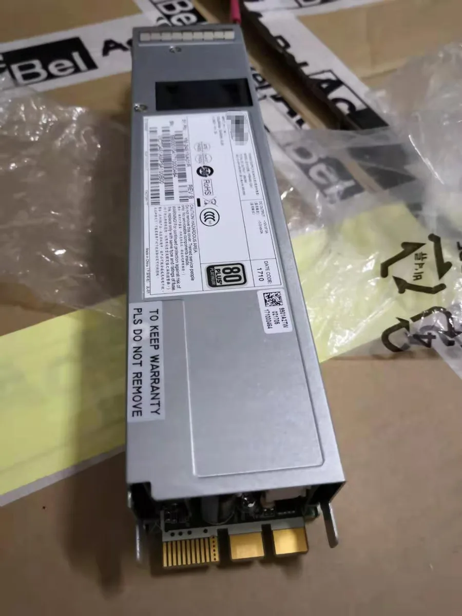 Rectangular metal power supply unit with fan grille and connector face