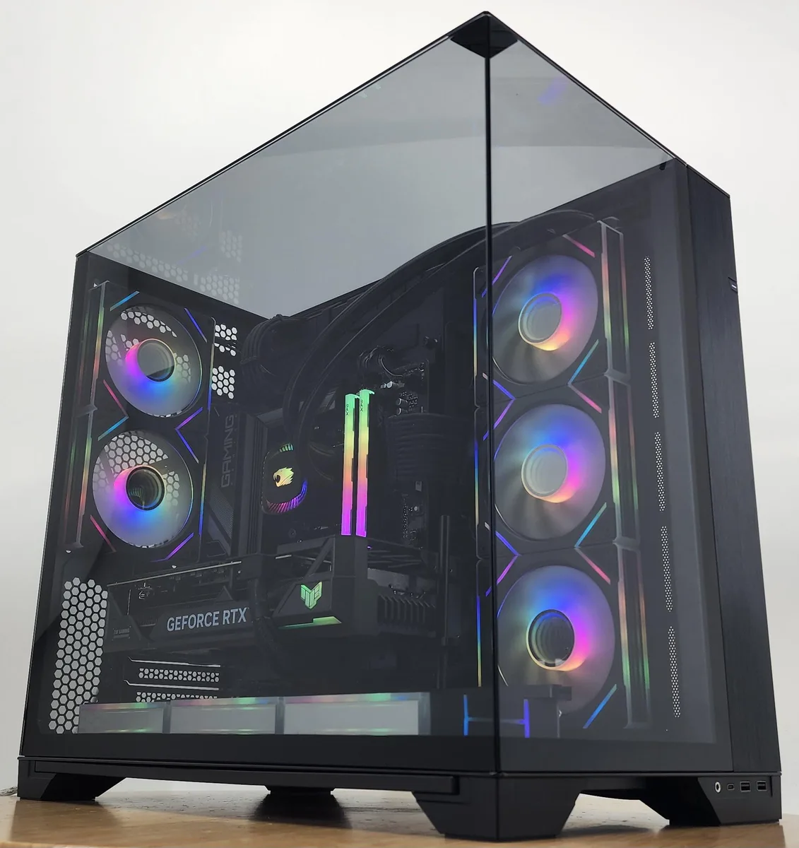 Black Lian Li O11 Vision case with 360mm AIO cooler and RTX 4070 Ti SUPER graphics card visible through tempered glass side panel