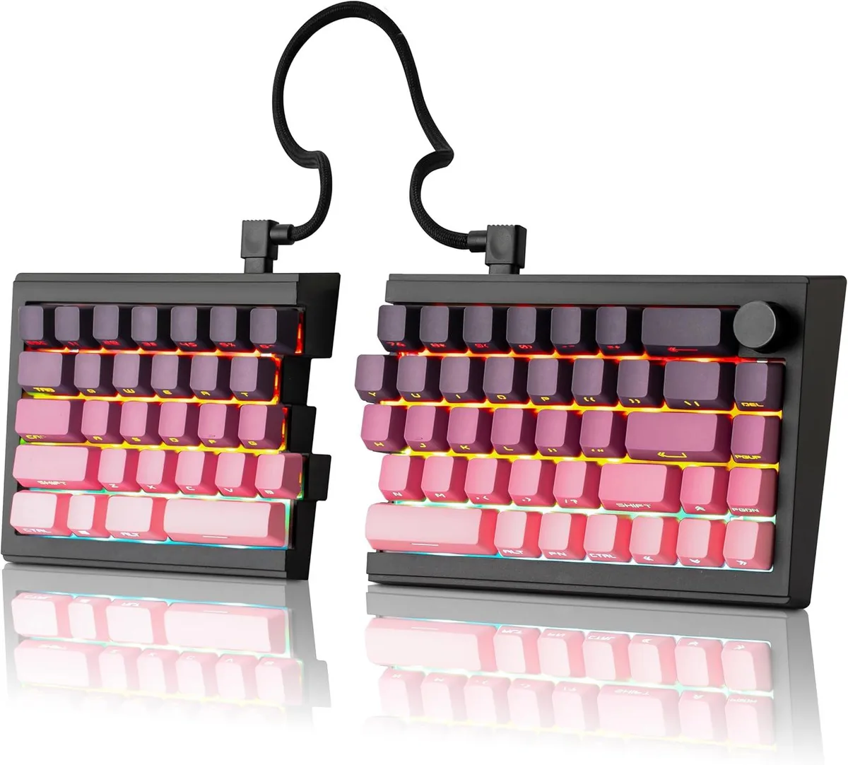 Pink and purple split mechanical keyboard halves with coiled cable link and rotary knob