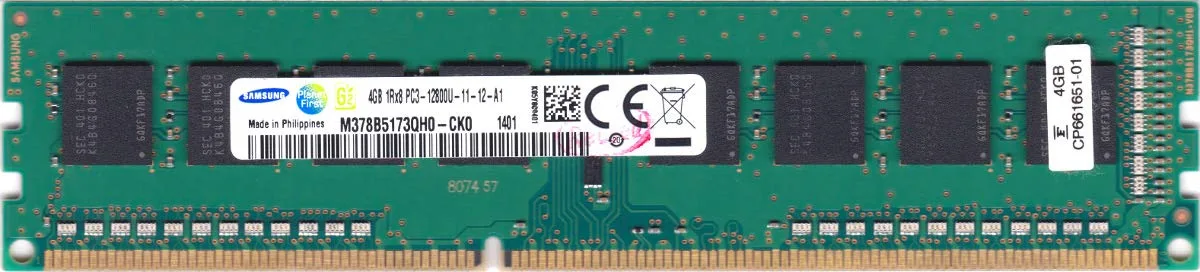 Green printed circuit board with black memory chips and gold edge connectors
