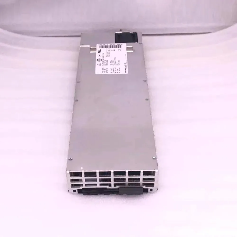 Rectangular silver power supply module with front label and rear connector visible