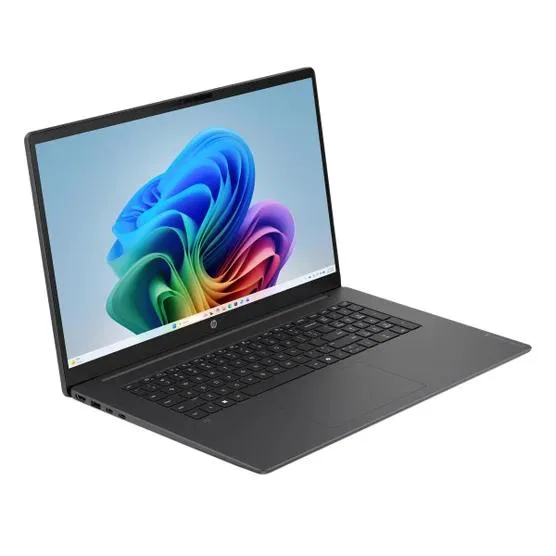 Silver 17.3 inch touchscreen laptop open on desk showing Windows 11 desktop