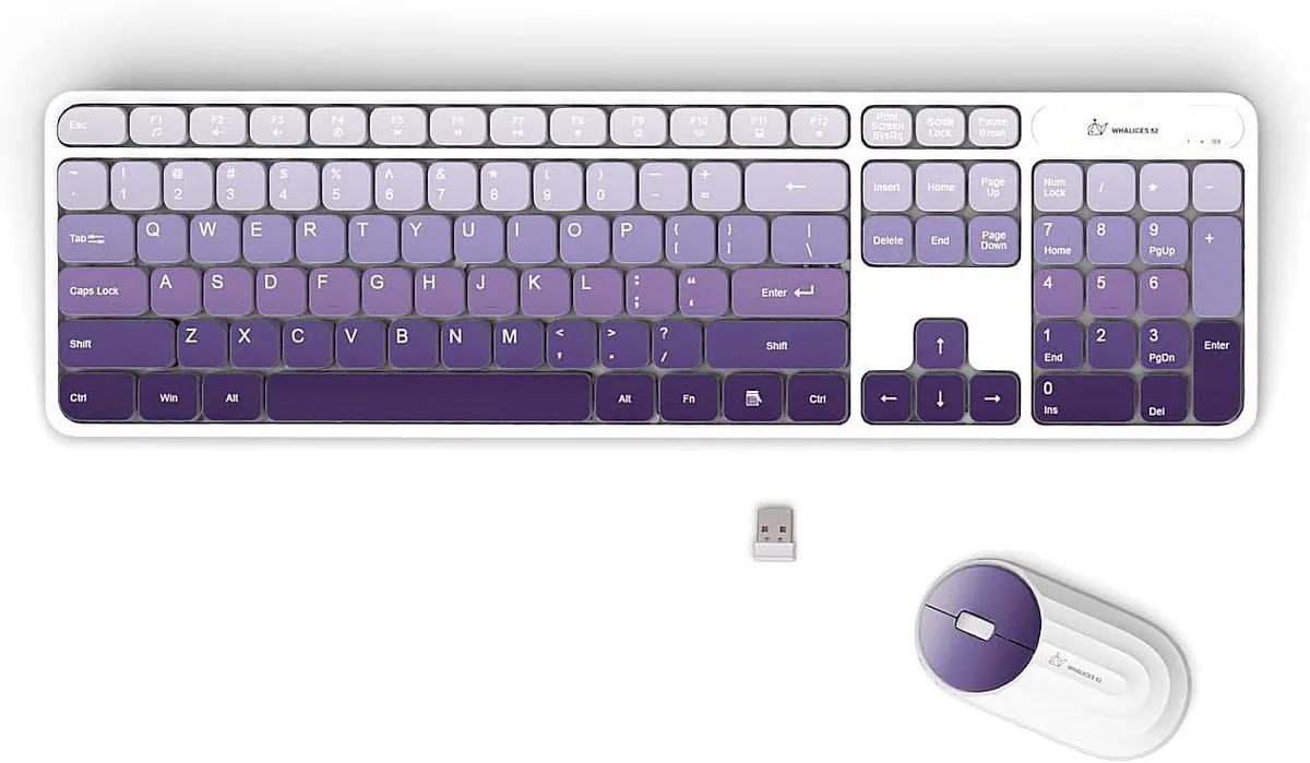 Gradient purple full-size wireless keyboard and matching mouse on a desk