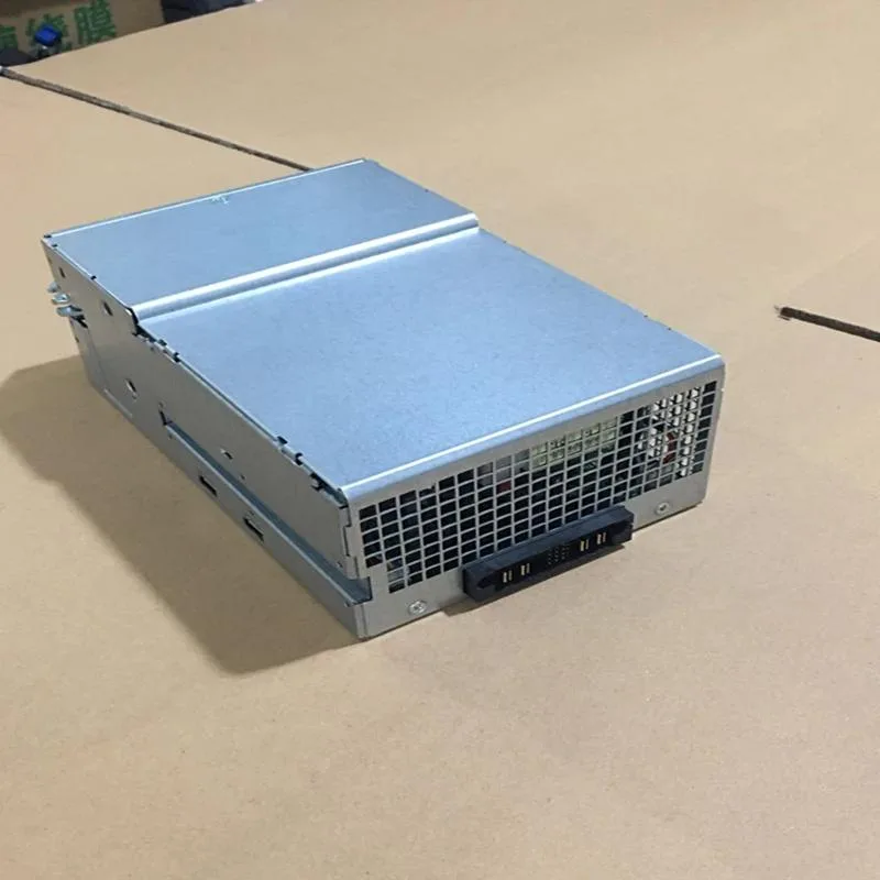 Rectangular silver ATX power supply unit with fan grille and label showing model numbers
