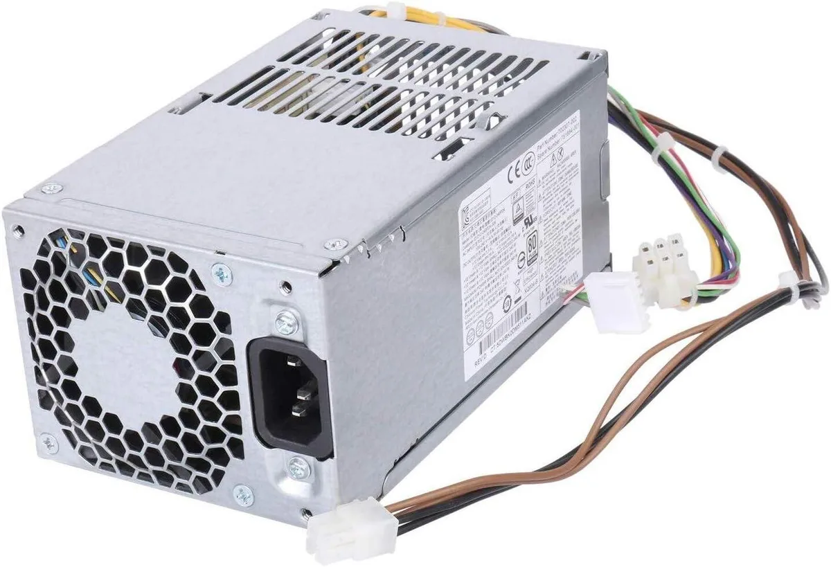 Black rectangular metal power supply unit with multiple cable connectors visible