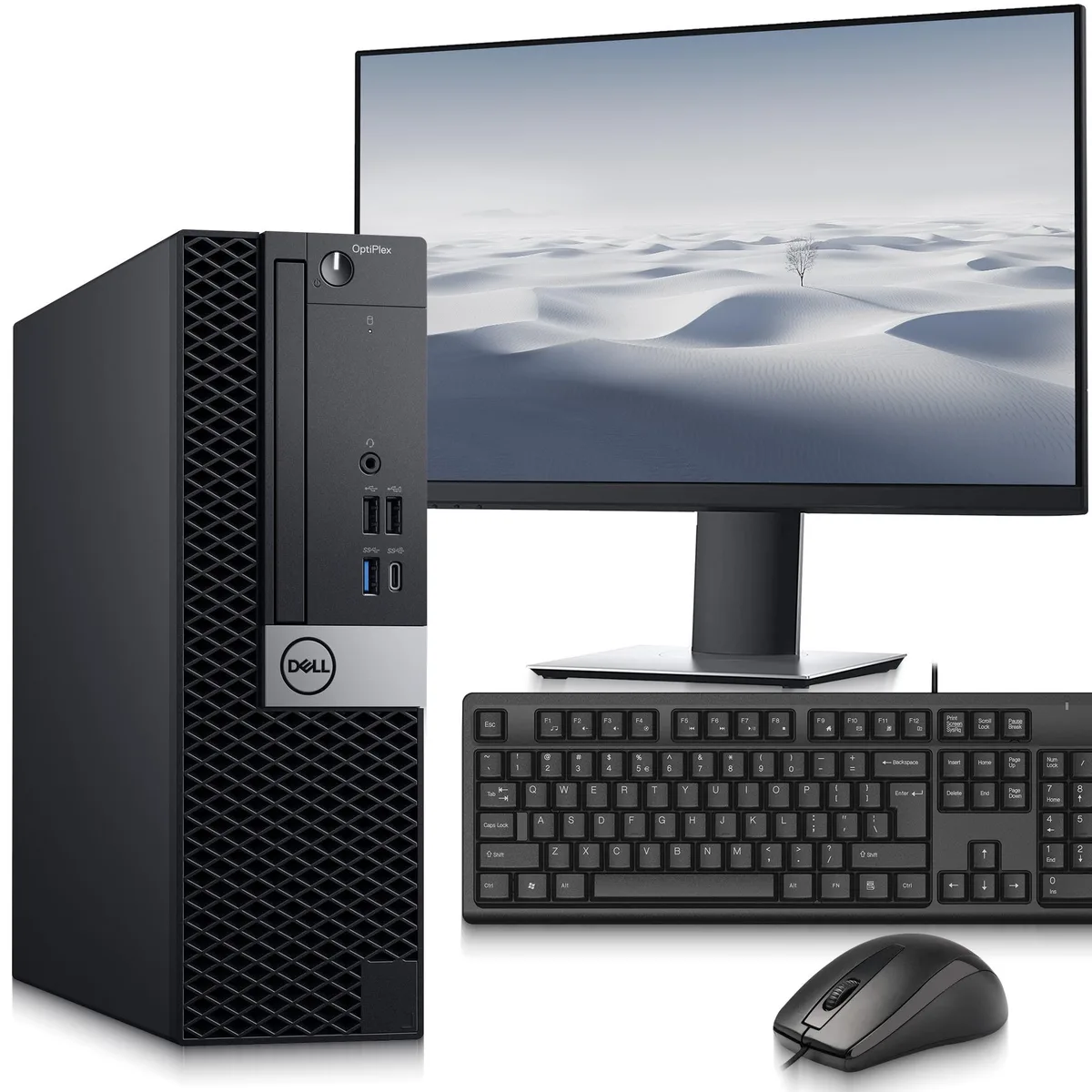 Small black desktop tower beside 24 inch monitor with keyboard and mouse