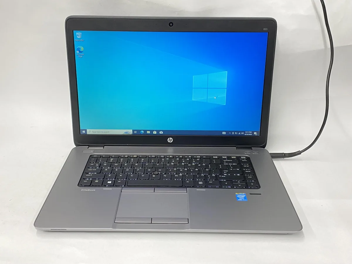 Silver HP EliteBook 850 G1 laptop with 15 inch non-touch display and charger