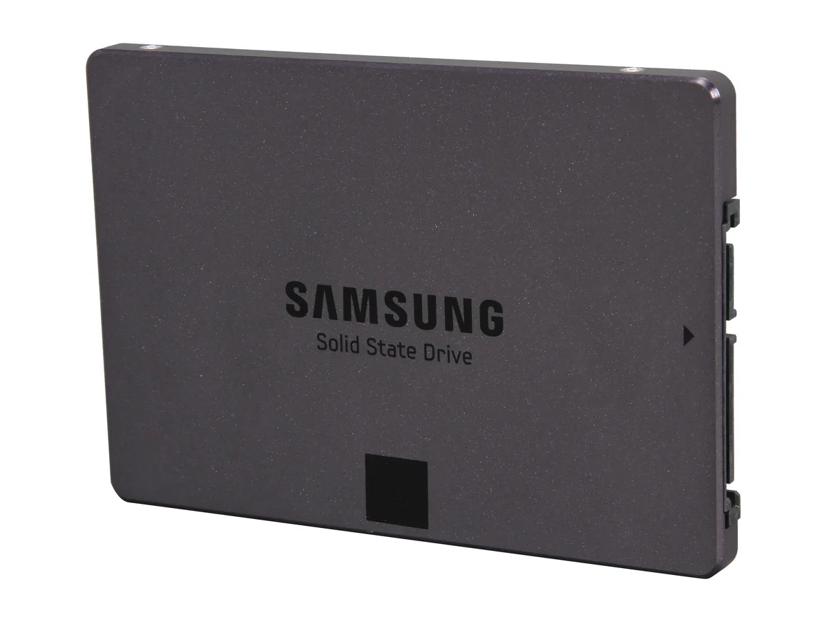 A flat black rectangular 2.5 inch SSD with label and gold connectors