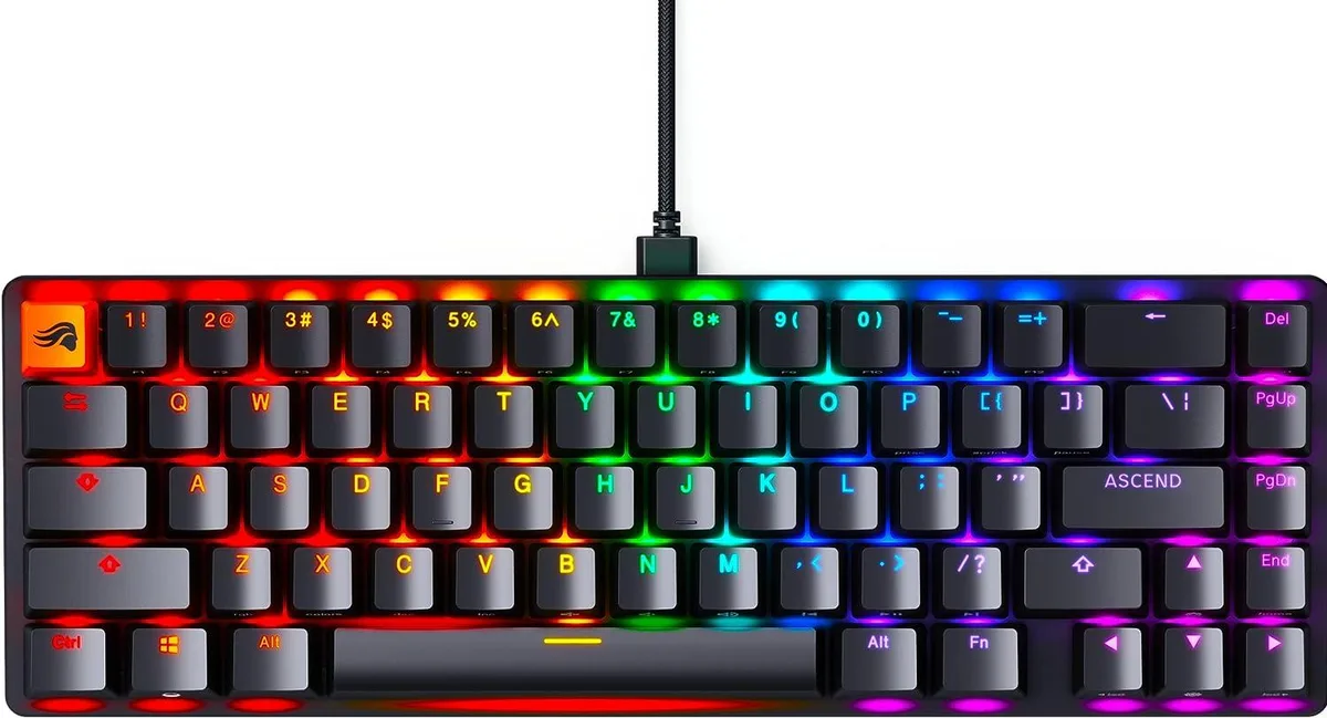 Compact 65 percent mechanical keyboard in matte black with low-profile keycaps and visible switches