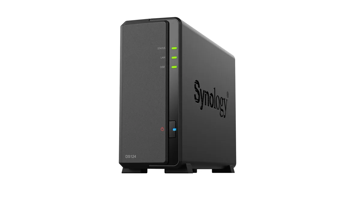 Compact white desktop NAS tower with single drive bay and front status LEDs