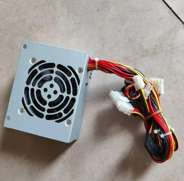 Compact SFX power supply unit with metal casing and rear fan grille