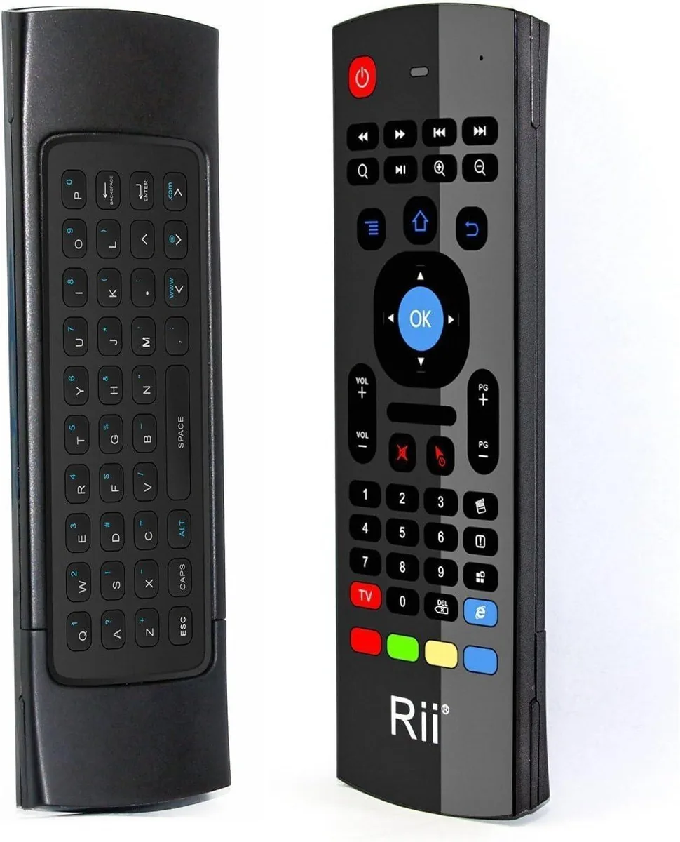 Black handheld mini keyboard with built-in fly mouse and IR remote, compact QWERTY layout