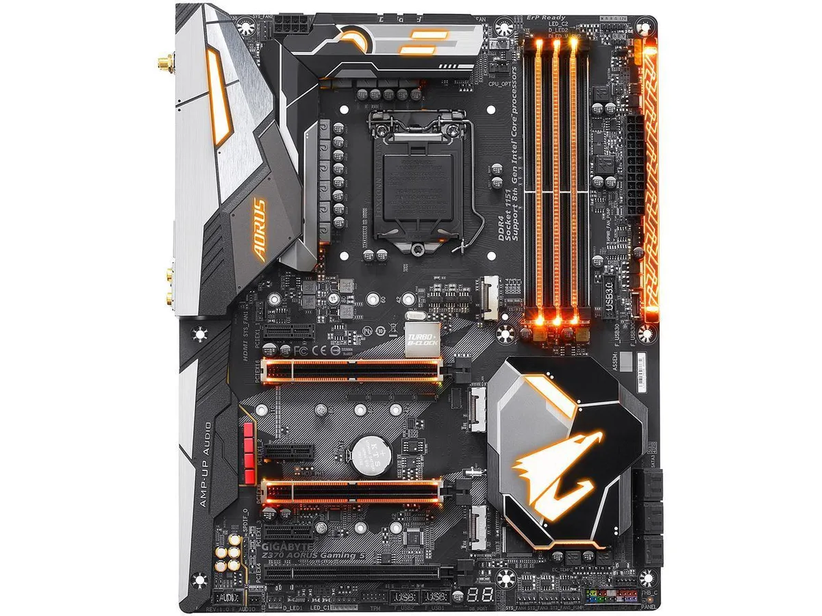 Black ATX motherboard with silver heatsinks and RGB lighting accents
