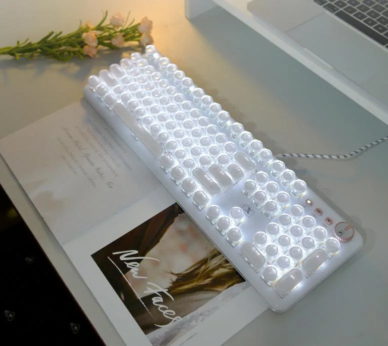 White mechanical gaming keyboard with retro typewriter style keycaps, blue switches