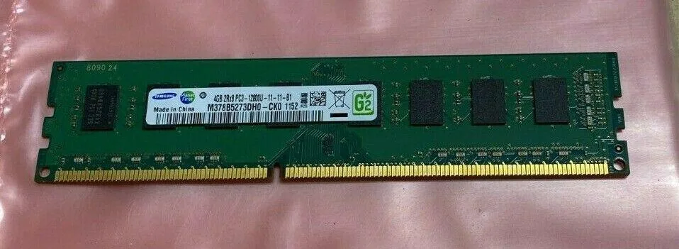 Green rectangular DDR3 memory stick with gold edge contacts