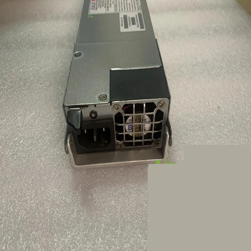 Silver ATX power supply unit with rear fan grille and cable bundle