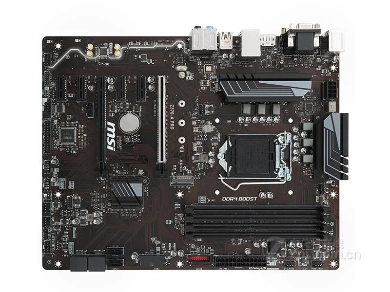 Black ATX motherboard with silver heatsinks, black PCB, four DDR4 slots, multiple PCIe slots, rear I/O shield attached