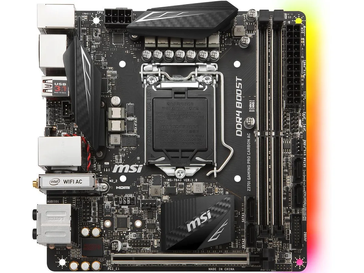 Mini-ITX motherboard, dark carbon-finish PCB with silver heatsinks and rear I/O shield