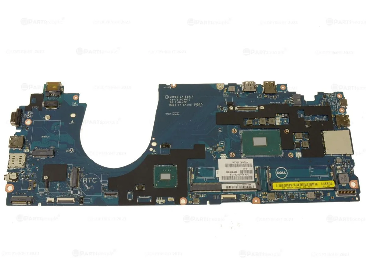 Green laptop motherboard with silver CPU socket and mounted heatsink
