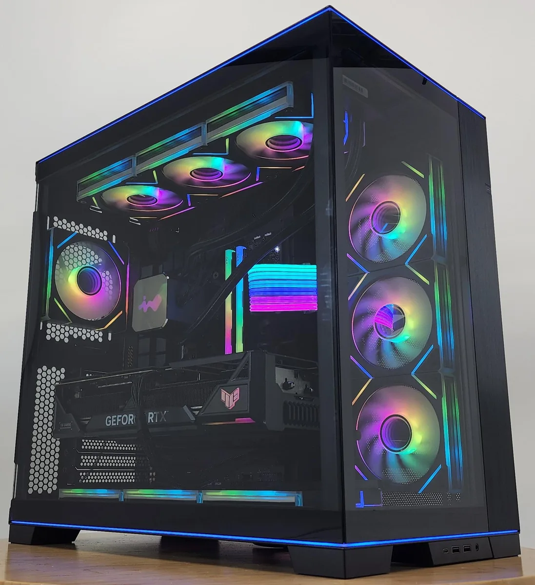 White mid-tower case with glass panels, RGB lighting and 360mm AIO cooler visible inside