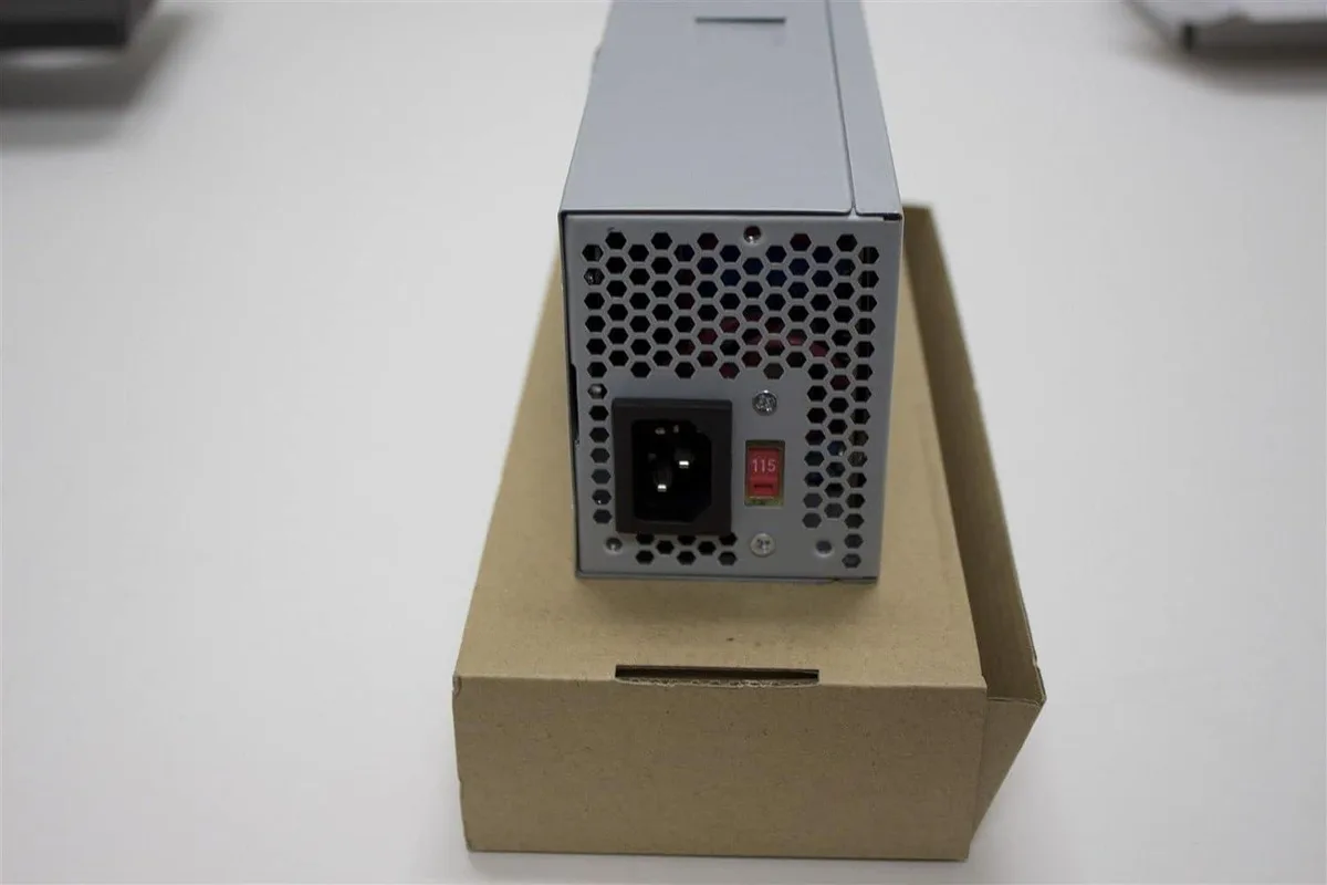 Compact TFX power supply unit with 80mm cooling fan and multiple cable connectors