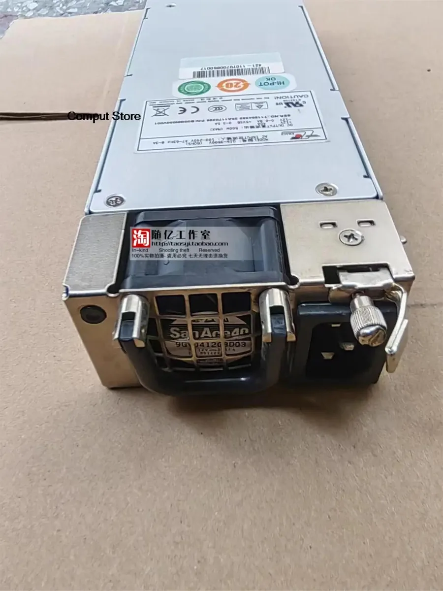 Rectangular metal ATX power supply unit with ventilation grille and label