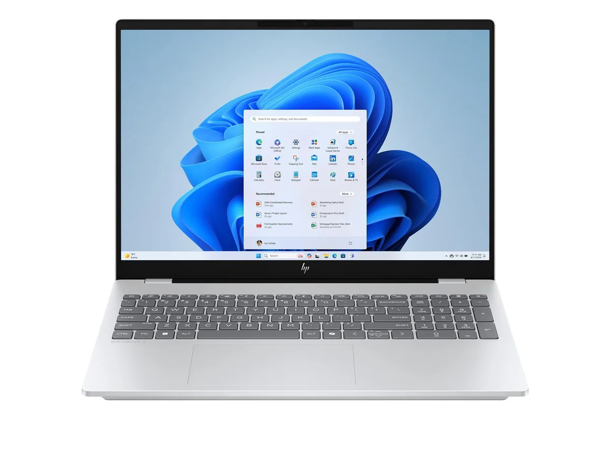 Silver aluminium 16 inch OLED touchscreen laptop closed on desk