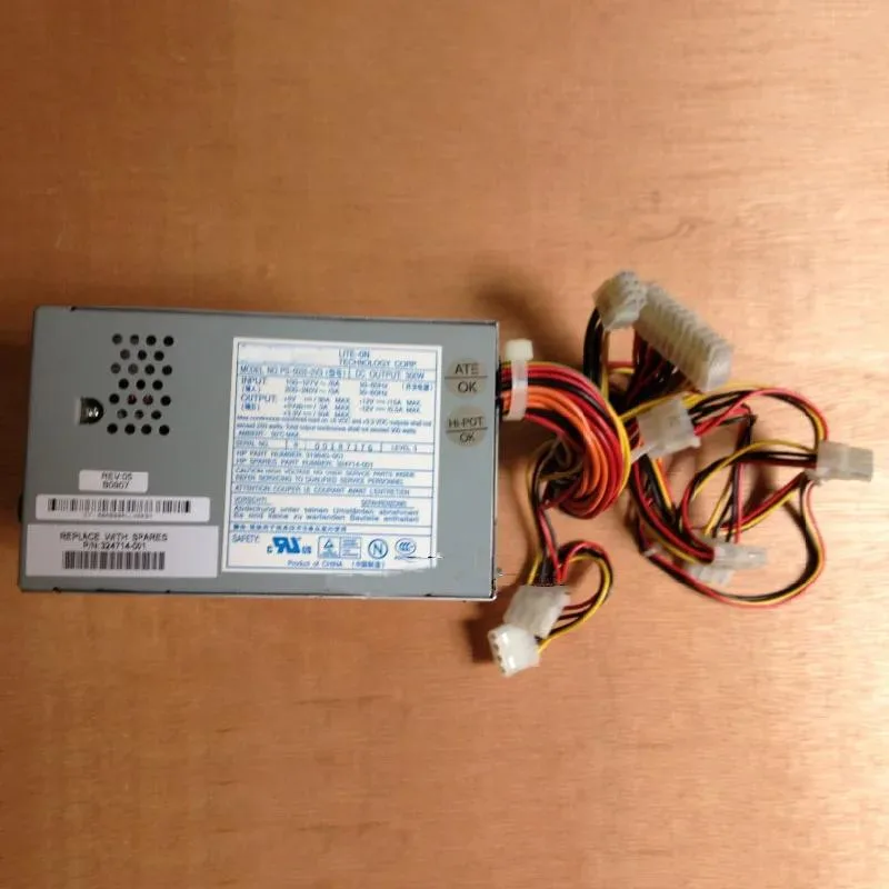 Rectangular metal server power supply unit with ventilation grille and label visible