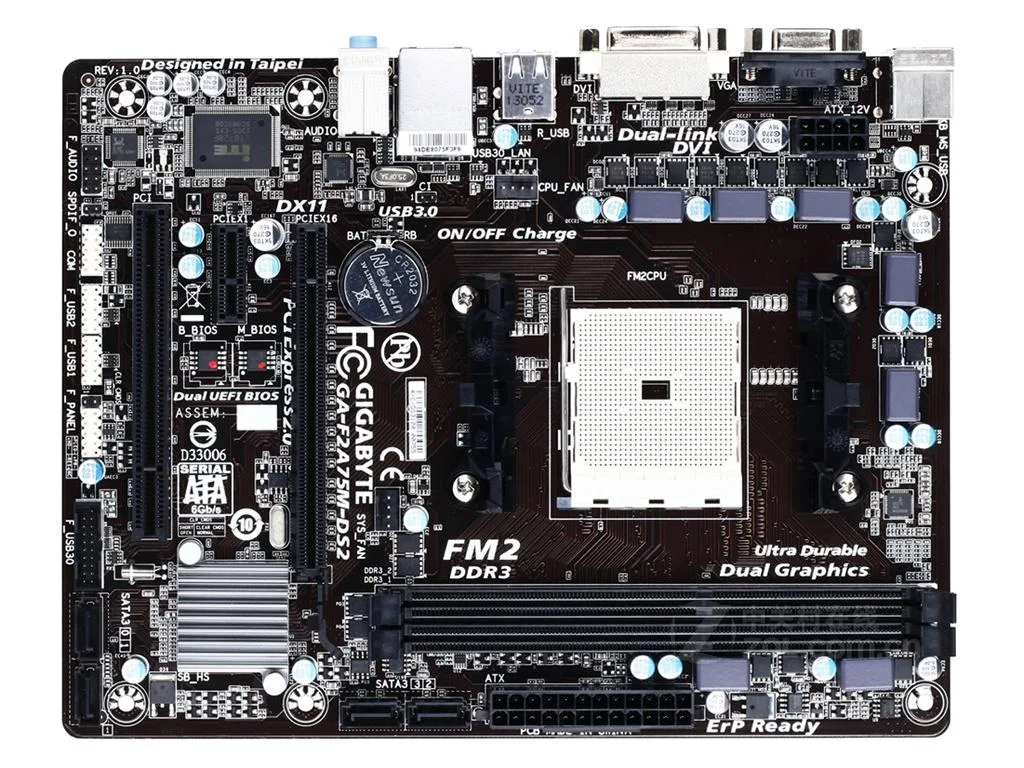 Green micro ATX motherboard with black sockets and silver heatsinks