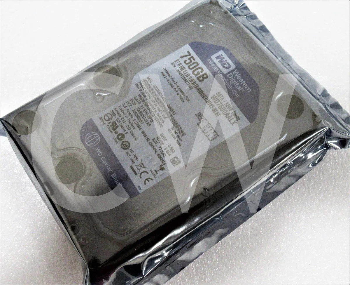 Silver rectangular 3.5 inch bare hard drive with circuit board visible